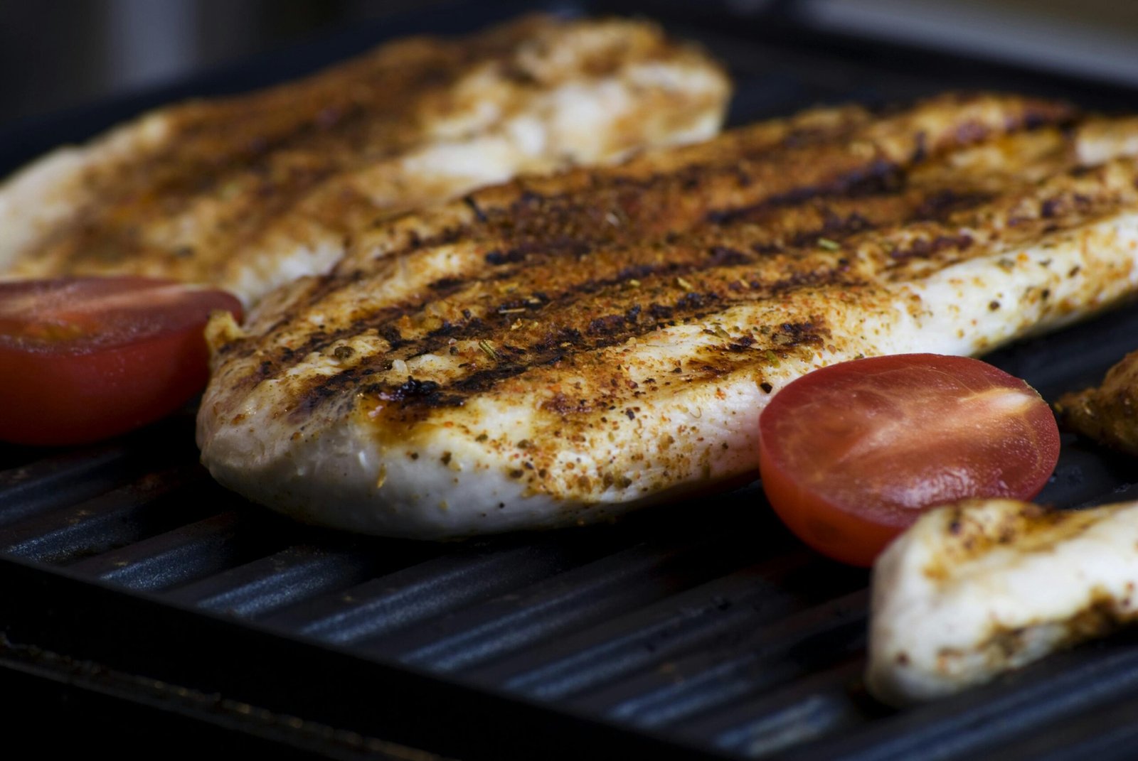 Juicy Grilled Chicken Breast on the Barbecue Gril